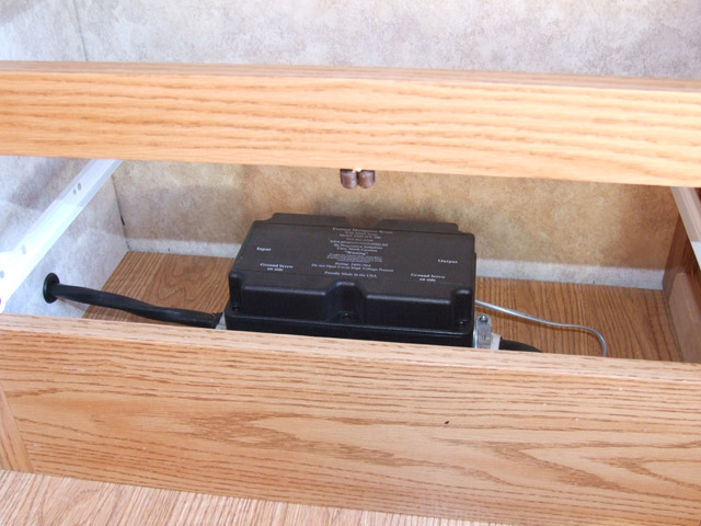 Placed under drawer in kitchen