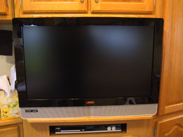 TV with a support shelf below. Frame size 2 1/2" wide Oak boards w/crosslap corner joints for strength.