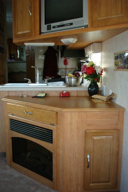 Deeper fireplace to allow for desk along side wall.