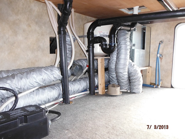 Utilities behind basement wall