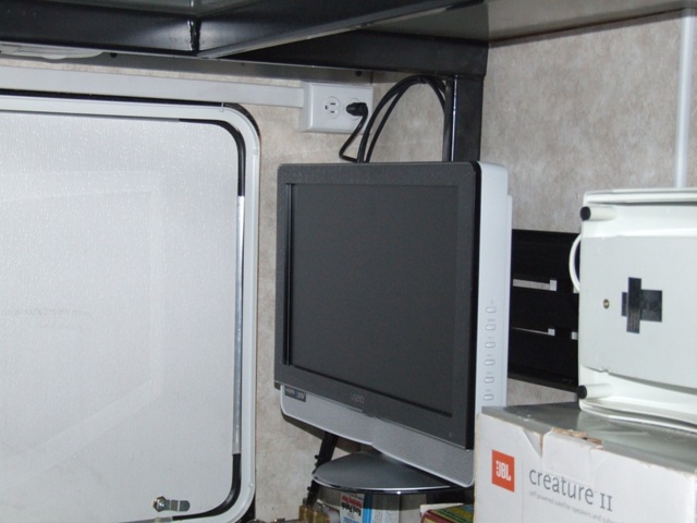 TV folded for storage with view of receptacle