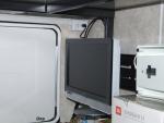 TV folded for storage with view of receptacle