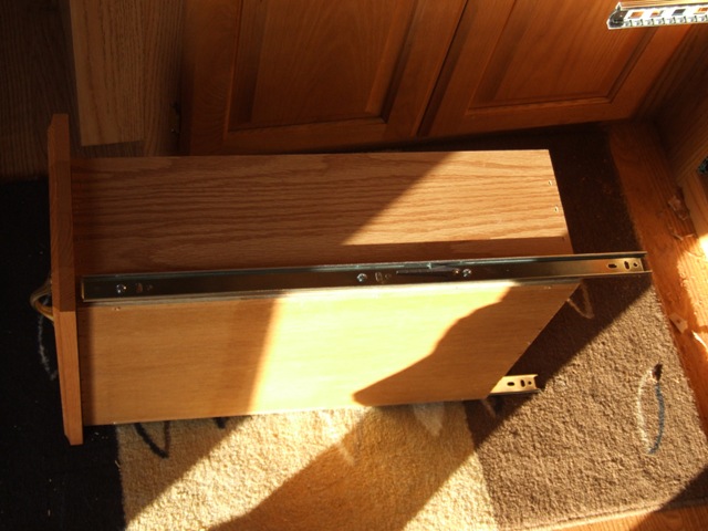 Guides mounted to drawer